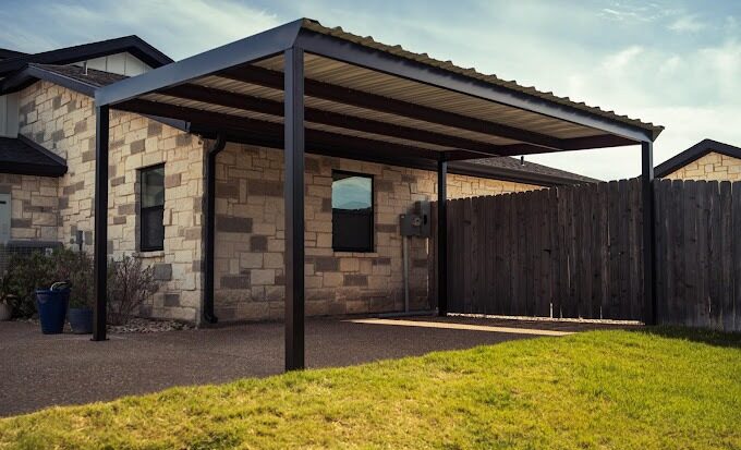 Single metal carport with red steel frame in Waco, TX