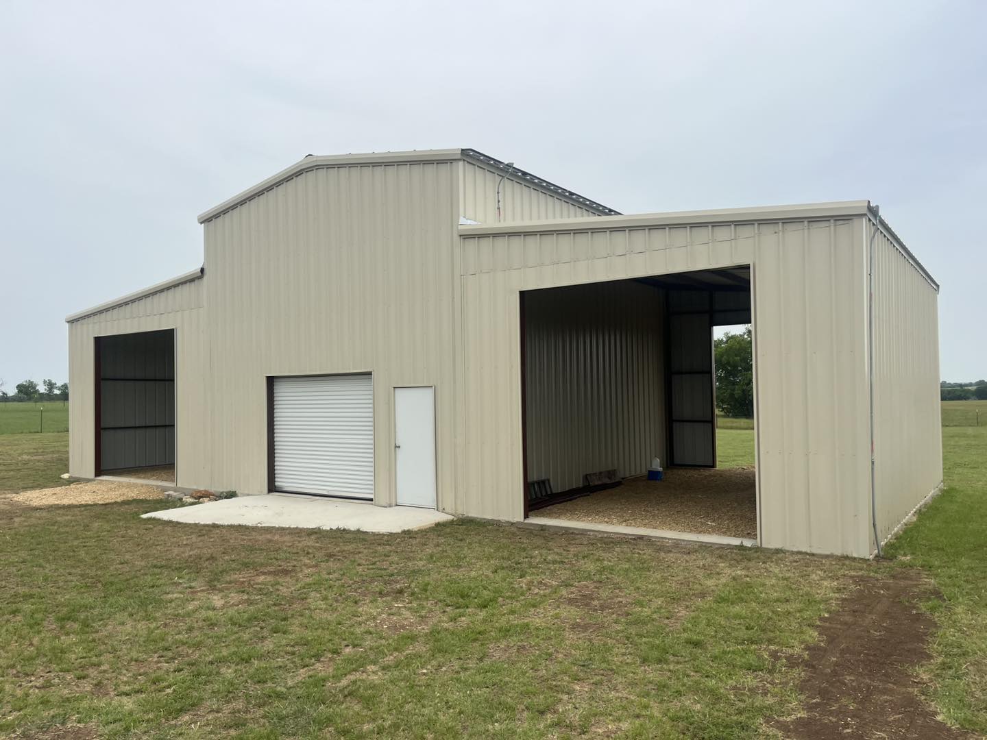 Custom metal garage building with roll-up doors