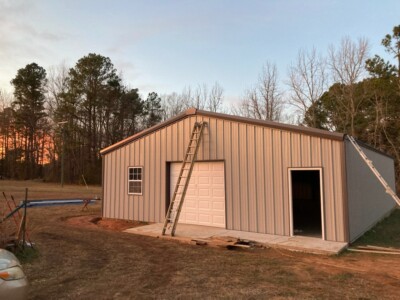 metal building workshop with garage door waco tx